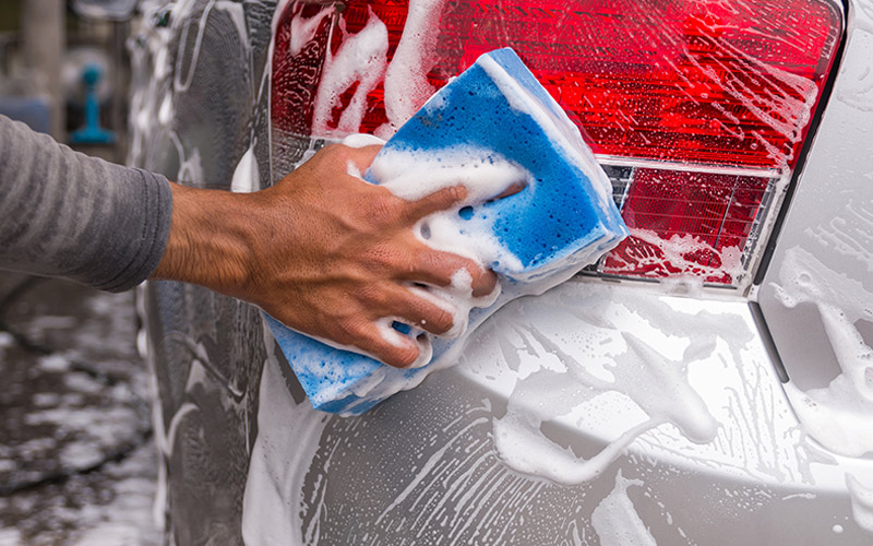 Person washing their vehicle