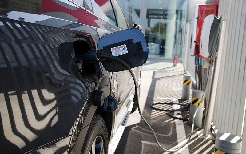 Electric Van At Public Charging Station