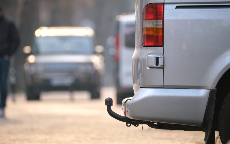 Silver van fitted with a towbar ready for towing