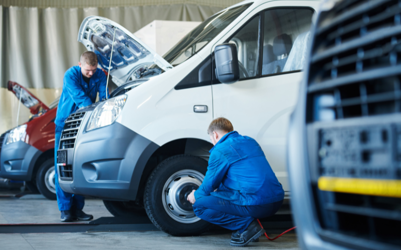 Van being serviced by two technicians